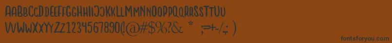 LITTLE BOSS Font – Black Fonts on Brown Background