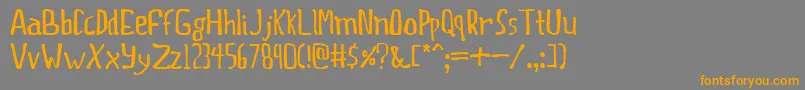 フォントThisprty – オレンジの文字は灰色の背景にあります。