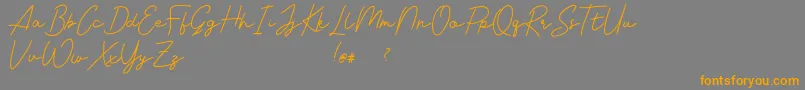 Livvie Signature Font – Orange Fonts on Gray Background