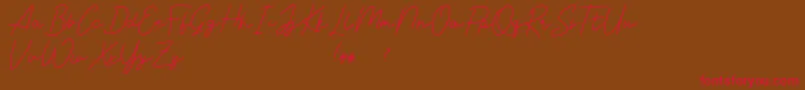 Livvie Signature Font – Red Fonts on Brown Background