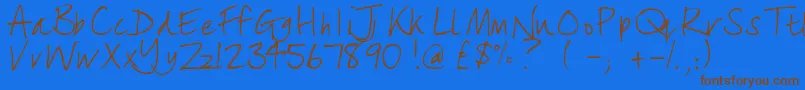 lizzielongstocking-Schriftart – Braune Schriften auf blauem Hintergrund