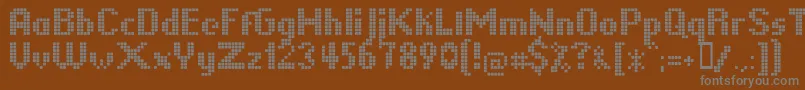 LLPIKSEL-fontti – harmaat kirjasimet ruskealla taustalla