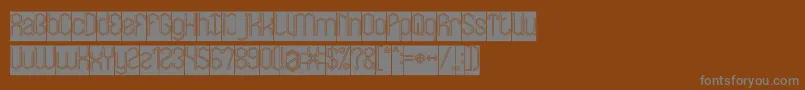 Więcej informacji o czcionce LOIS CESARANO Hollow Inverse Czcionka LOIS CESARANO Hollow Inverse – szare czcionki na brązowym tle