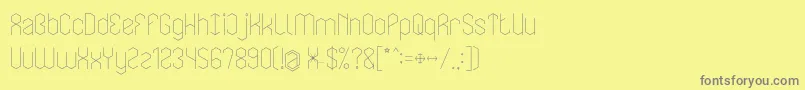 LOIS CESARANOフォントについての詳細 フォントLOIS CESARANO – 黄色の背景に灰色の文字