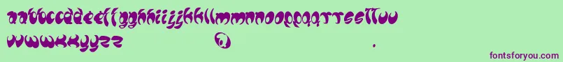 Lomax Font – Purple Fonts on Green Background