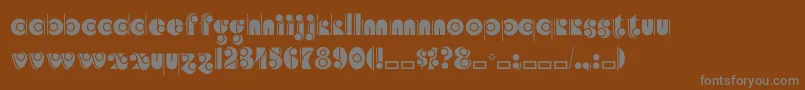 Angelicacp-fontti – harmaat kirjasimet ruskealla taustalla