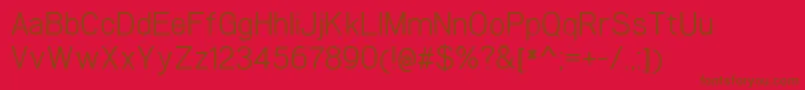 WoolworthBook-Schriftart – Braune Schriften auf rotem Hintergrund