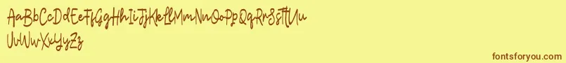 フォントLostera – 茶色の文字が黄色の背景にあります。