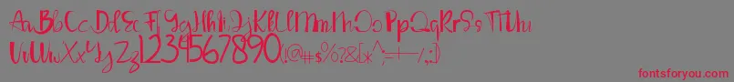 LouiseAnn-Schriftart – Rote Schriften auf grauem Hintergrund