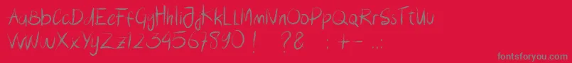Lousiana Brush-fontti – harmaat kirjasimet punaisella taustalla