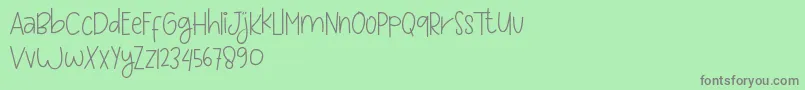 Więcej informacji o czcionce Love and sweet massage Czcionka Love and sweet massage – szare czcionki na zielonym tle