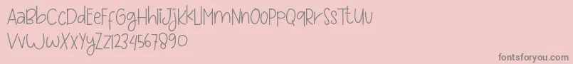 Lisätietoja Love and sweet massage-fontista Love and sweet massage-fontti – harmaat kirjasimet vaaleanpunaisella taustalla