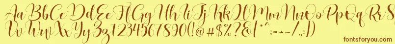 Lovea Font – Brown Fonts on Yellow Background