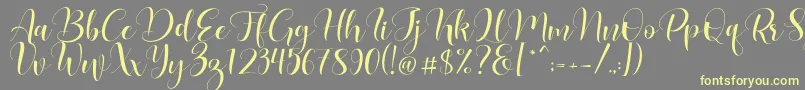 Lovea Font – Yellow Fonts on Gray Background