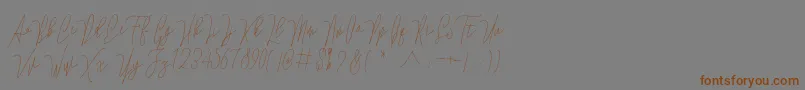 Lovellyana Free-Schriftart – Braune Schriften auf grauem Hintergrund