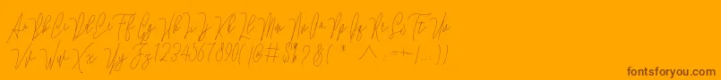Więcej informacji o czcionce Lovellyana Free Czcionka Lovellyana Free – brązowe czcionki na pomarańczowym tle