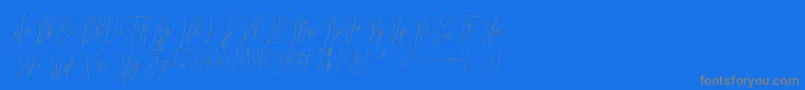 Lovellyana Free Font – Gray Fonts on Blue Background
