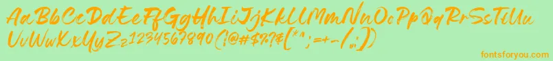 フォントLovely Boys Font by 7NTypes D – オレンジの文字が緑の背景にあります。