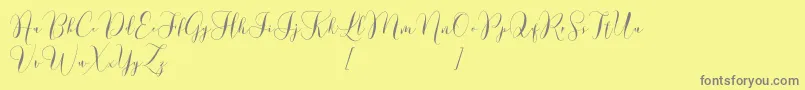 Lovely Dramatis Demo Font – Gray Fonts on Yellow Background