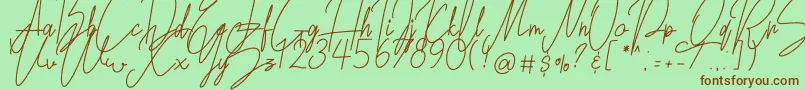 Fonte Lovely Jeanne Script – fontes marrons em um fundo verde