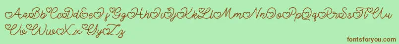 Czcionka Lovely Valentine – brązowe czcionki na zielonym tle