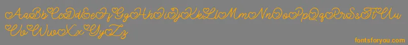 フォントLovely Valentine – オレンジの文字は灰色の背景にあります。