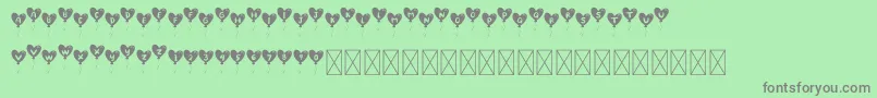 LovelyBalloon Font – Gray Fonts on Green Background