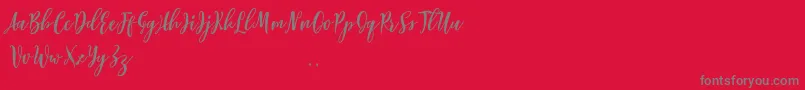 Fonte Lovelyou free – fontes cinzas em um fundo vermelho