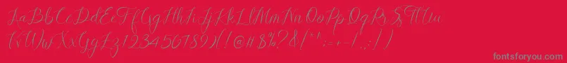 フォントLovestrong Script PERSONAL USE – 赤い背景に灰色の文字