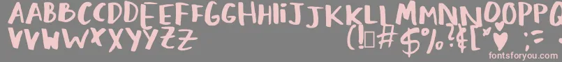フォントLovingMemories Regular – 灰色の背景にピンクのフォント