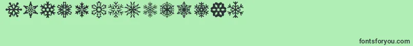 lpsnowflake-Schriftart – Schwarze Schriften auf grünem Hintergrund