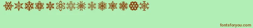 Fonte lpsnowflake – fontes marrons em um fundo verde