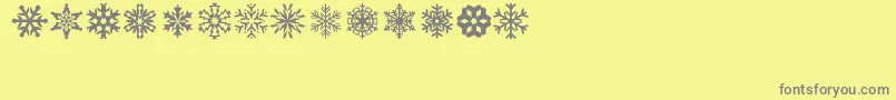 lpsnowflake-Schriftart – Graue Schriften auf gelbem Hintergrund