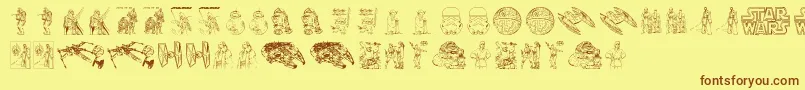 フォントLucas characters – 茶色の文字が黄色の背景にあります。