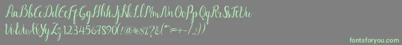 フォントLuciana Script – 灰色の背景に緑のフォント