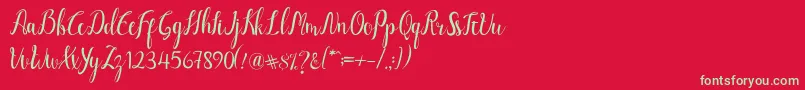 フォントLuciana Script – 赤い背景に緑の文字