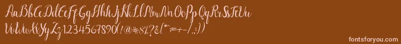 フォントLuciana Script – 茶色の背景にピンクのフォント