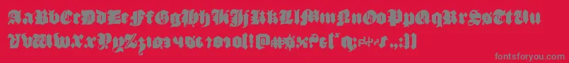 フォントluxcontratenebrascond – 赤い背景に灰色の文字