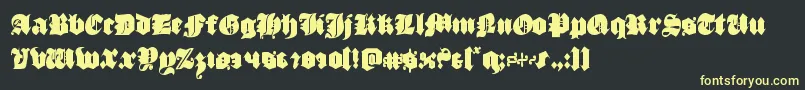 フォントluxcontratenebrascond – 黒い背景に黄色の文字