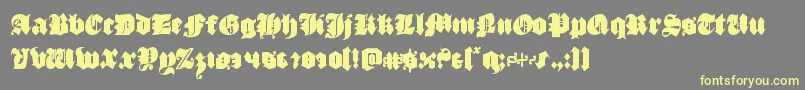 フォントluxcontratenebrascond – 黄色のフォント、灰色の背景