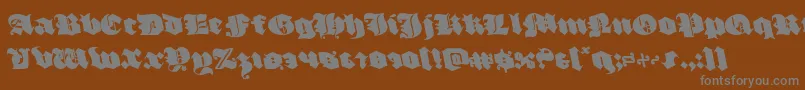 Czcionka luxcontratenebrasleft – szare czcionki na brązowym tle