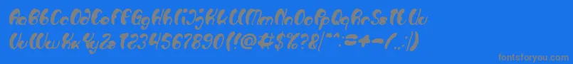 Czcionka Luxurious Sexy Bold Italic – szare czcionki na niebieskim tle