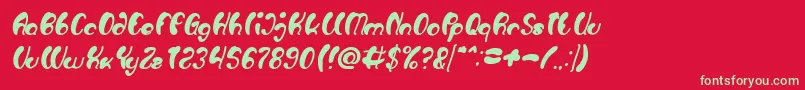 Fonte Luxurious Sexy Bold Italic – fontes verdes em um fundo vermelho