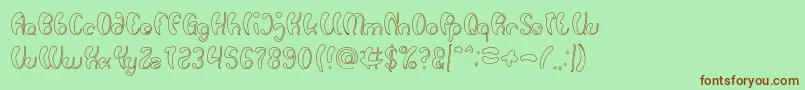 Шрифт Luxurious Sexy Hollow – коричневые шрифты на зелёном фоне