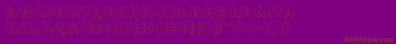 Шрифт Luxurious Sexy Hollow – коричневые шрифты на фиолетовом фоне