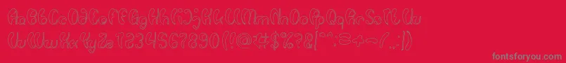 Luxurious Sexy Hollow-fontti – harmaat kirjasimet punaisella taustalla