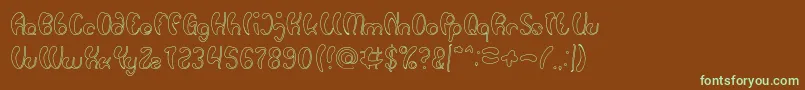 フォントLuxurious Sexy Hollow – 緑色の文字が茶色の背景にあります。