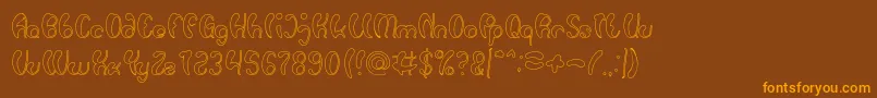 フォントLuxurious Sexy Hollow – オレンジ色の文字が茶色の背景にあります。