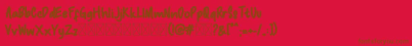 Macadamia-fontti – ruskeat fontit punaisella taustalla