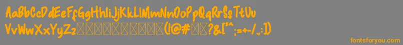 Macadamia Font – Orange Fonts on Gray Background